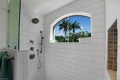 a bathroom with a bathtub and a shower
