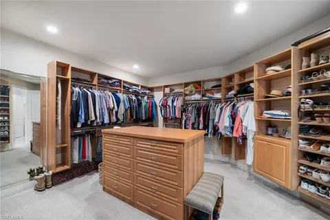 a view of a patio with table and chairs under an umbrella