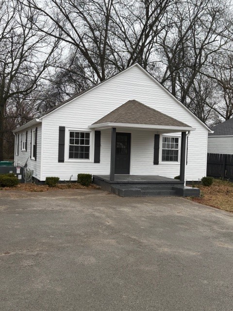 417 Laura Avenue Winchester, TN 37398 - Photo 2 of 18 a front view of a house with a yard and garage