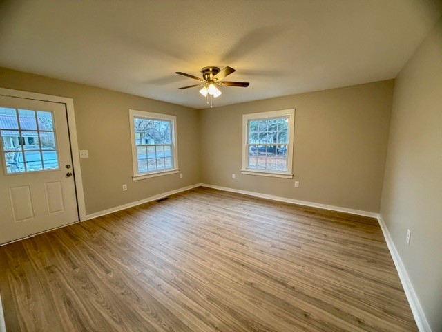 417 Laura Avenue Winchester, TN 37398 - Photo 3 of 18 wooden floor in an empty room with a window