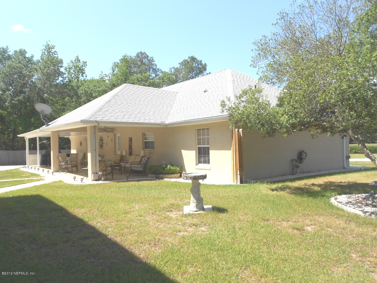 2796 Kings Road St. Augustine, FL 32086 - Photo 11 of 20 a front view of a house with garden