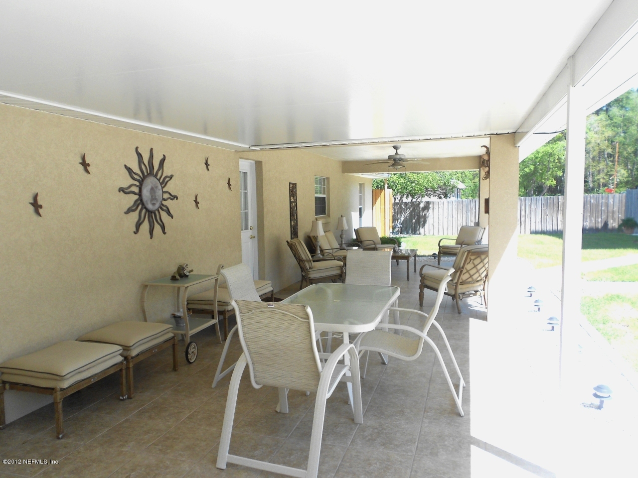 2796 Kings Road St. Augustine, FL 32086 - Photo 13 of 20 a dining room with furniture and a floor to ceiling window