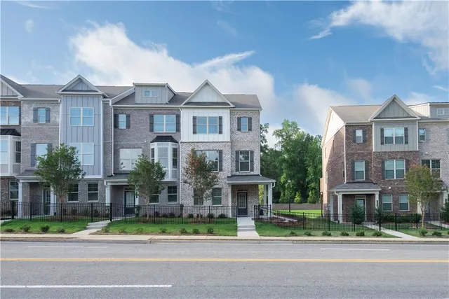 a front view of residential houses and street