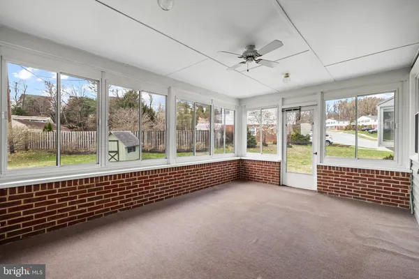 a view of an empty room with a balcony