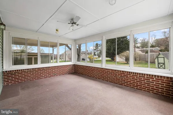 a view of an empty room with a large window