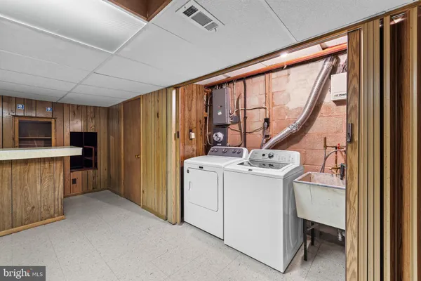 a bathroom with a toilet a sink and a mirror
