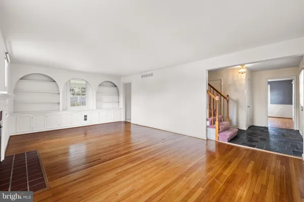 a view of a livingroom with wooden floor