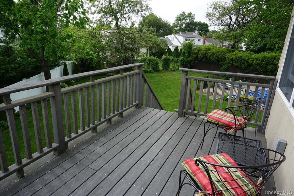 15 Reed Drive Deer Park, NY 11729 - Photo 2 of 12 a view of balcony with wooden floor and outdoor seating
