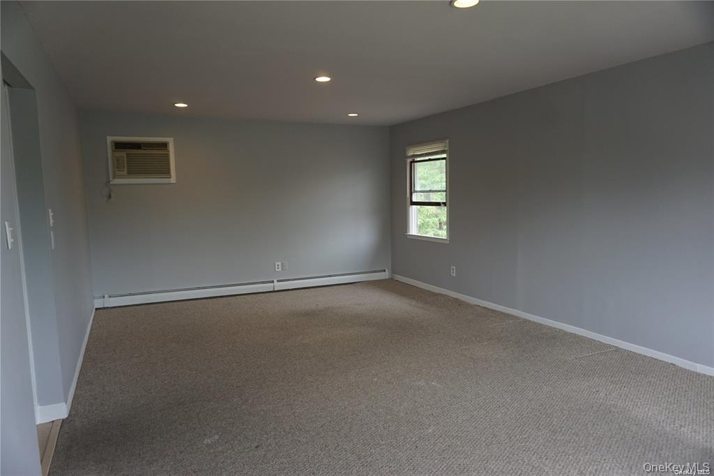 15 Reed Drive Deer Park, NY 11729 - Photo 6 of 12 a view of an empty room with a window