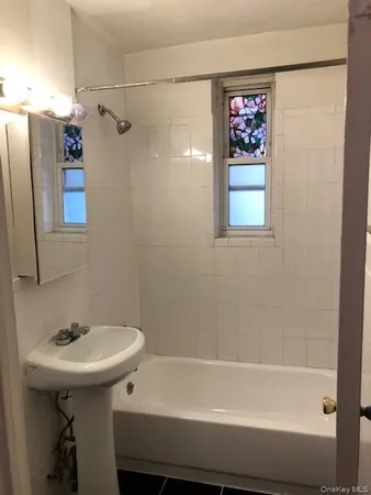 a bathroom with a sink and a bathtub