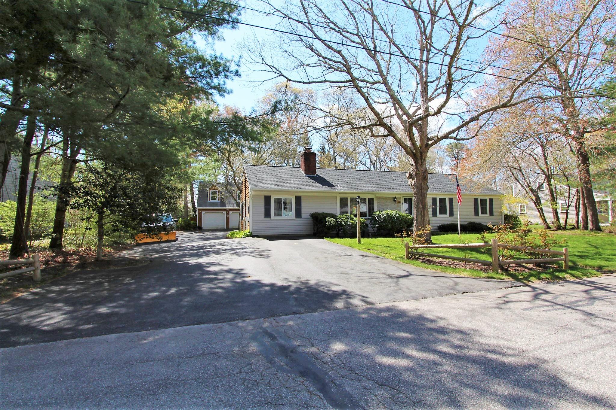 35 Tuckernuck Road Centerville, MA 02632 - Photo 1 of 28 a house with trees in front of it