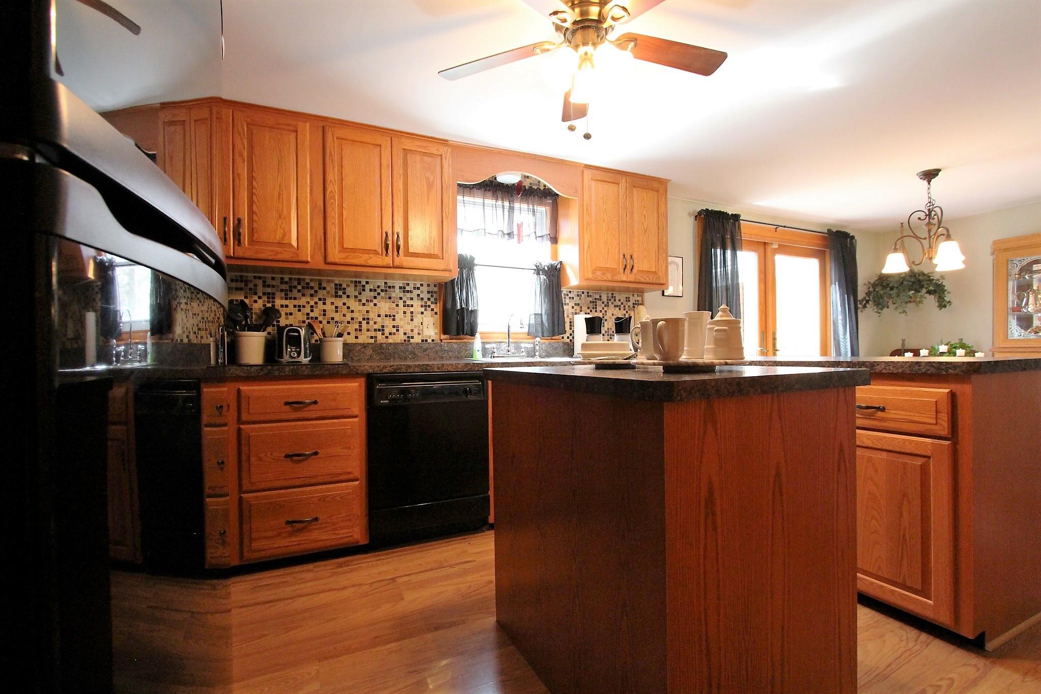 35 Tuckernuck Road Centerville, MA 02632 - Photo 22 of 28 a kitchen with stainless steel appliances granite countertop a refrigerator and a sink