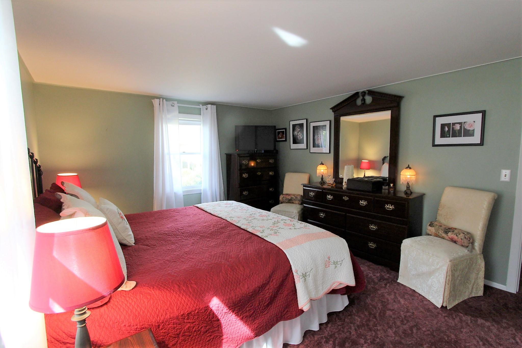 35 Tuckernuck Road Centerville, MA 02632 - Photo 23 of 28 a bedroom with a bed and a couch
