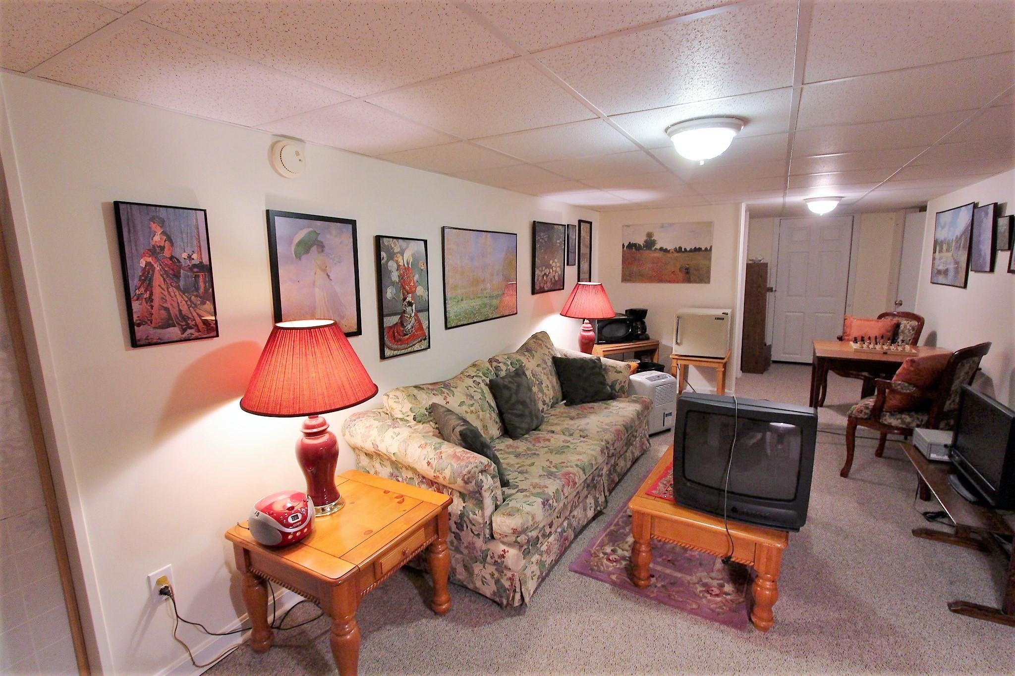 35 Tuckernuck Road Centerville, MA 02632 - Photo 25 of 28 a living room with furniture and a flat screen tv