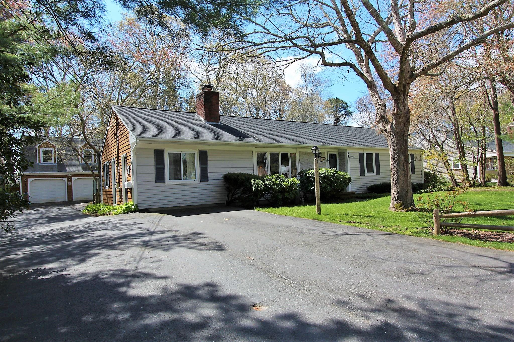 35 Tuckernuck Road Centerville, MA 02632 - Photo 26 of 28 a house that has a tree in front of it