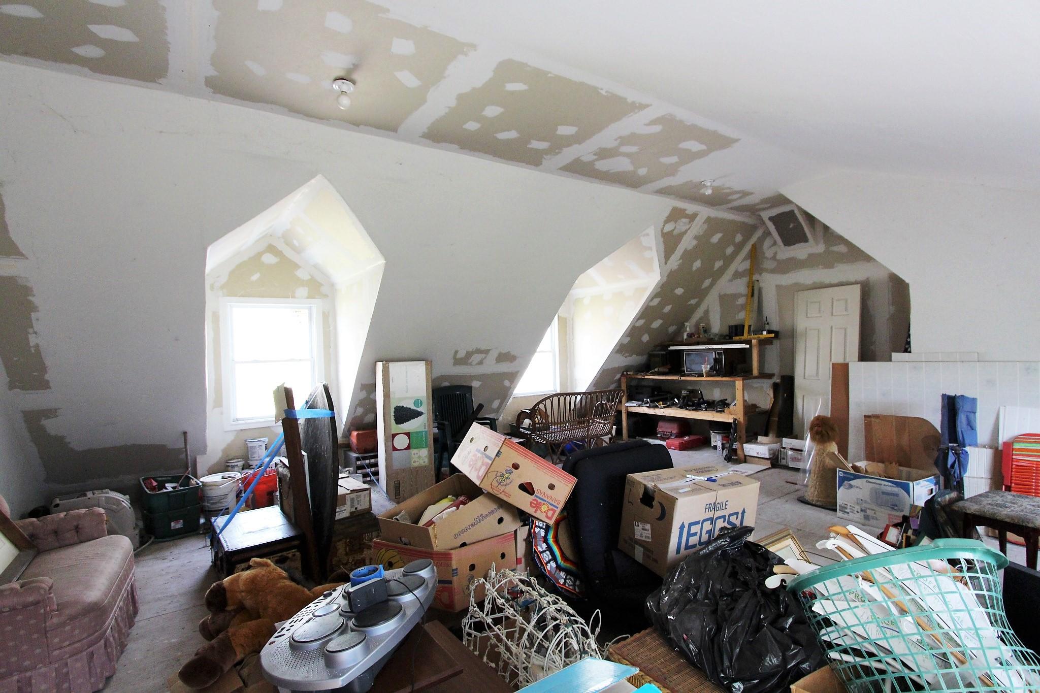 35 Tuckernuck Road Centerville, MA 02632 - Photo 27 of 28 a living room with lots of furniture and clutter