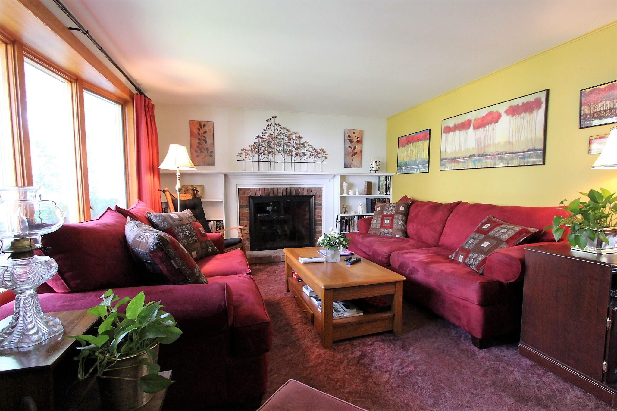 35 Tuckernuck Road Centerville, MA 02632 - Photo 9 of 28 a living room with furniture fireplace and a large window