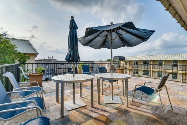 a swimming pool with outdoor seating and yard