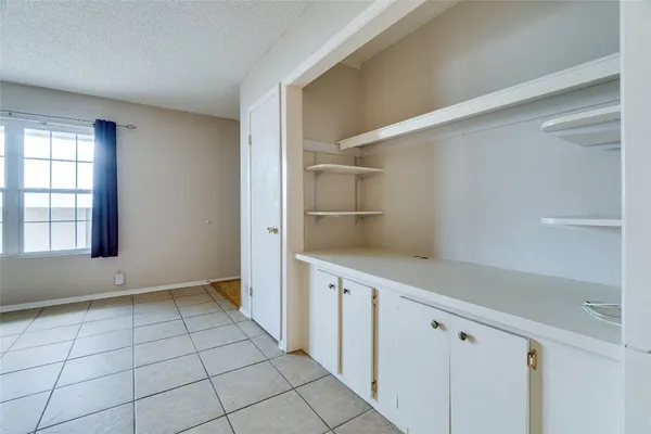 a kitchen with stainless steel appliances granite countertop a sink and a refrigerator