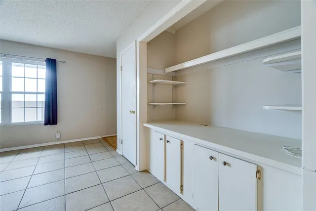 a kitchen with stainless steel appliances granite countertop a sink and a refrigerator