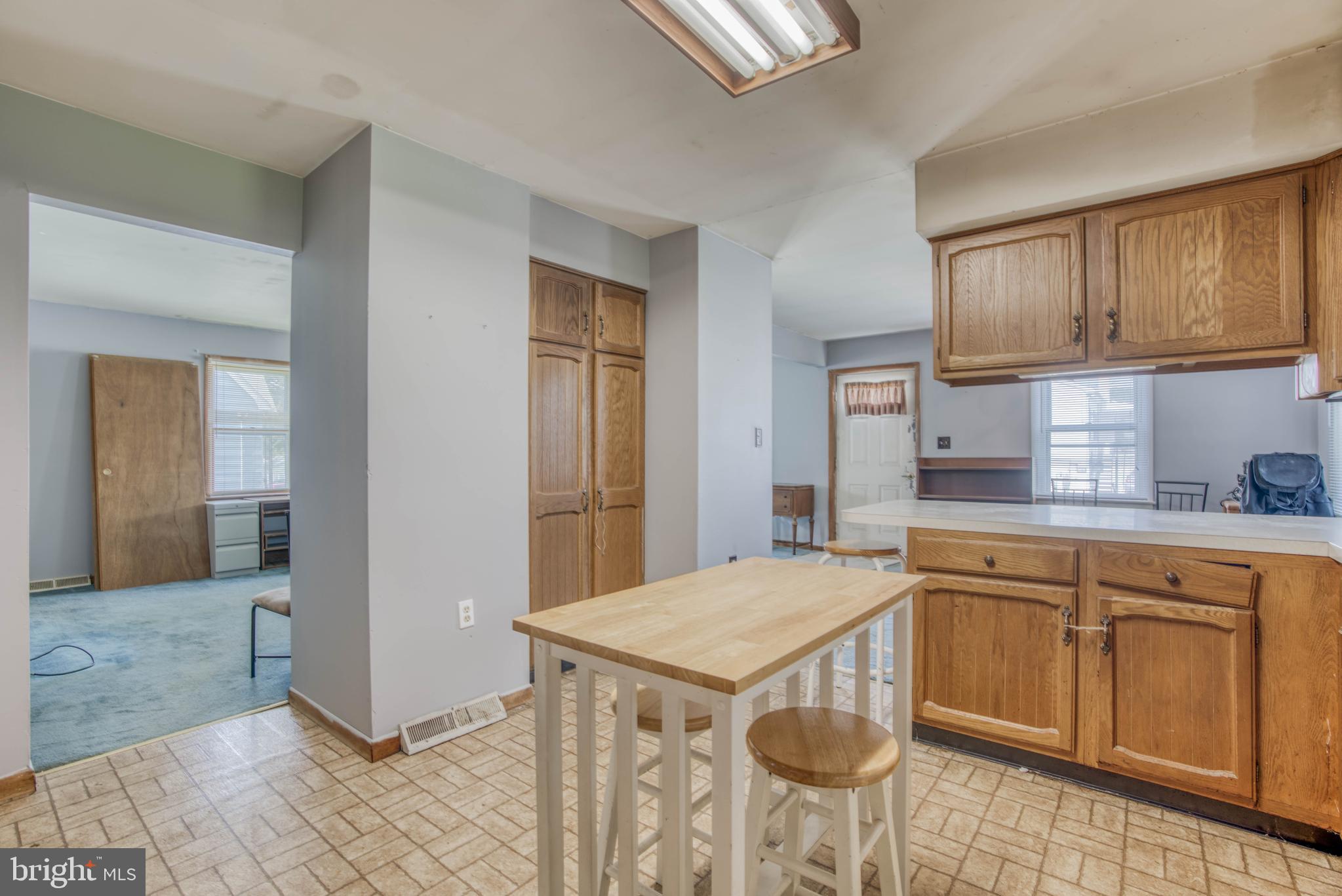 1720 Rita Road Baltimore, MD 21222 - Photo 5 of 34 KITCHEN WITH PANTRY AND LOOKING INTO LIVING ROOM