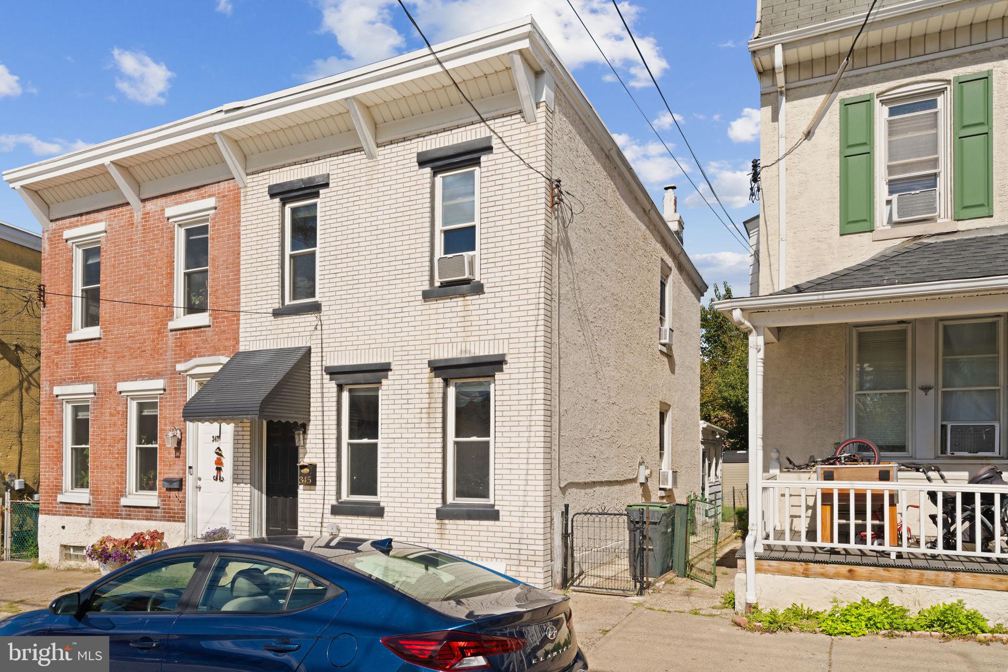 345 Hall Street Phoenixville, PA 19460 - Photo 2 of 32 a car parked in front of a white building
