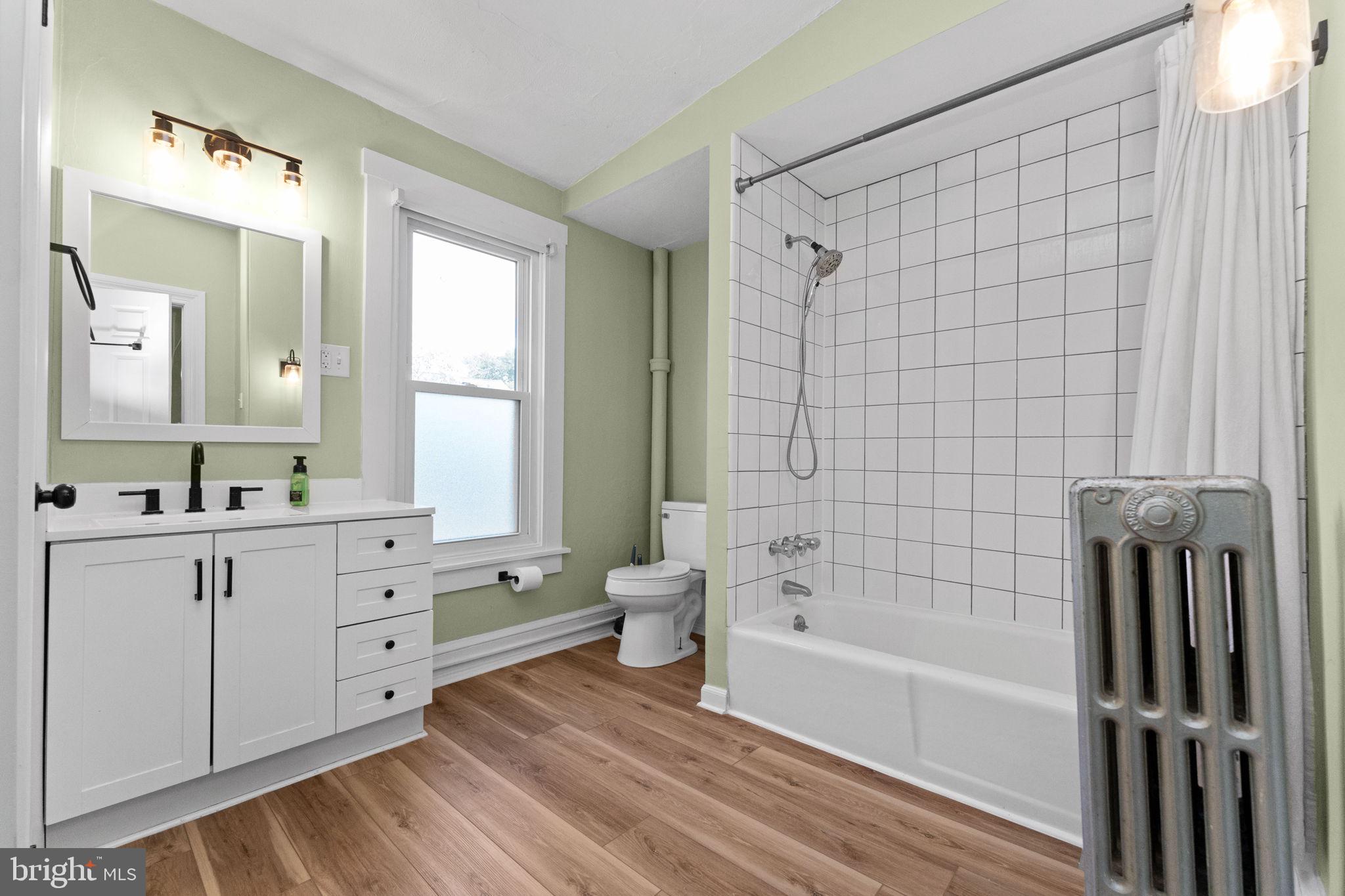 345 Hall Street Phoenixville, PA 19460 - Photo 23 of 32 a bathroom with a bathtub shower sink and toilet
