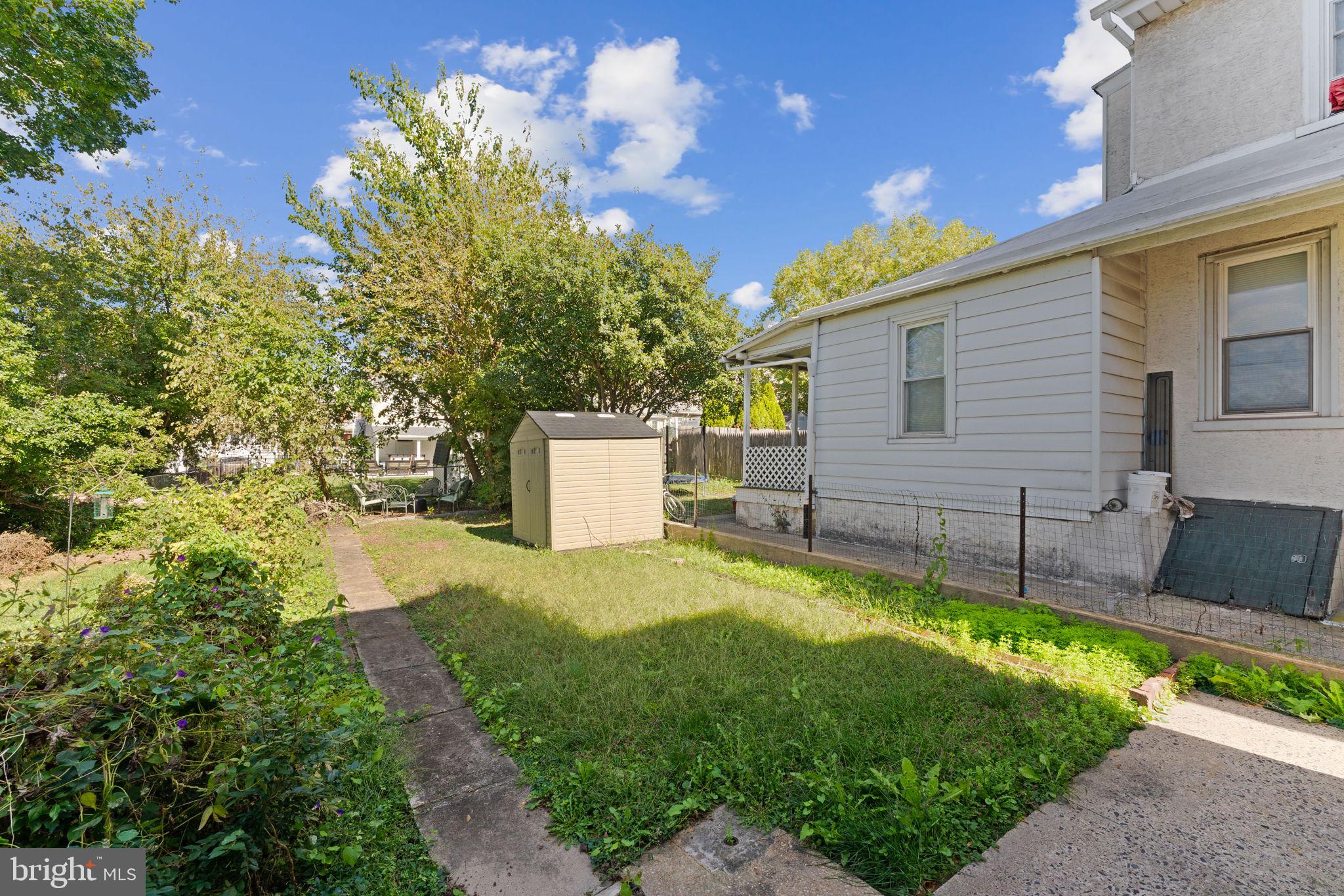 345 Hall Street Phoenixville, PA 19460 - Photo 27 of 32 a view of a backyard with a tree