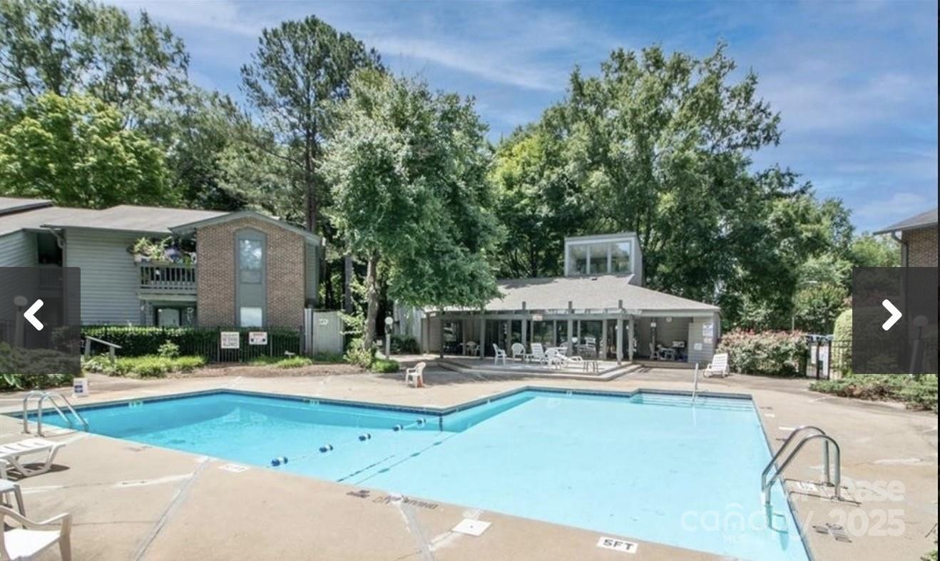 5008 Sardis Road, Unit F Charlotte, NC 28270 - Photo 18 of 19 a swimming pool with outdoor seating and yard