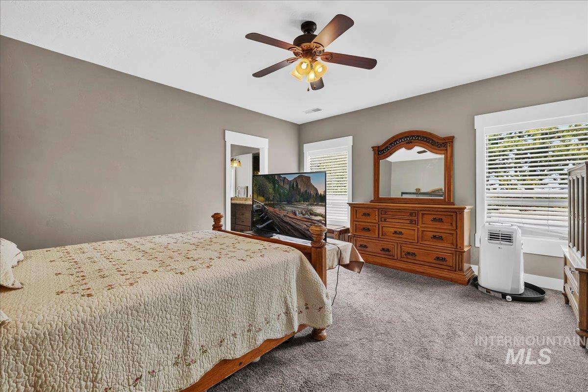 9222 Kemp Road Middleton, ID 83644 - Photo 16 of 35 Primary Bedroom #1. The portable AC unit is used only because one of the family members likes their bedroom cold at night and another family member likes their bedroom warm. This is their compromise. The HVAC system works great.
