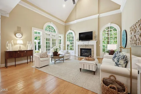 a living room with furniture fireplace and a flat screen tv