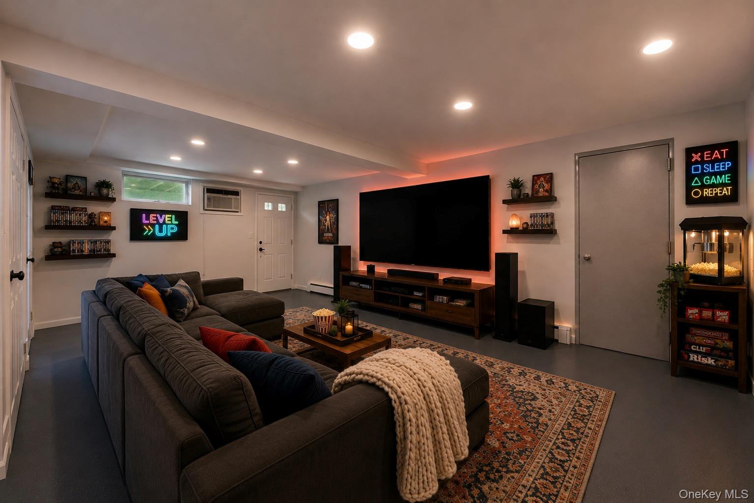 144 Bell Road Scarsdale, NY 10583 - Photo 35 of 49 Spacious entertainment room featuring recessed ceiling lights, an accent wall with backlighting, a built-in media console, and multiple wall-mounted display shelves