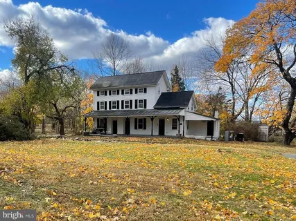a view of a building with a yard