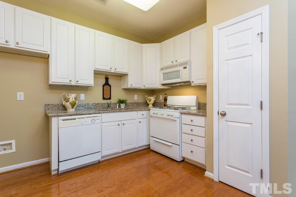 2211-102 Raven Road, Unit 102 Raleigh, NC 27614 - Photo 2 of 6 UPDATED kitchen with GRANITE counter tops and HARDWOOD floors.