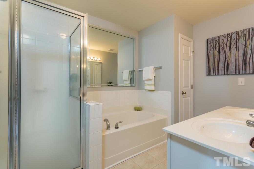 2211-102 Raven Road, Unit 102 Raleigh, NC 27614 - Photo 5 of 6 SPA tub and separate shower in the master bath.