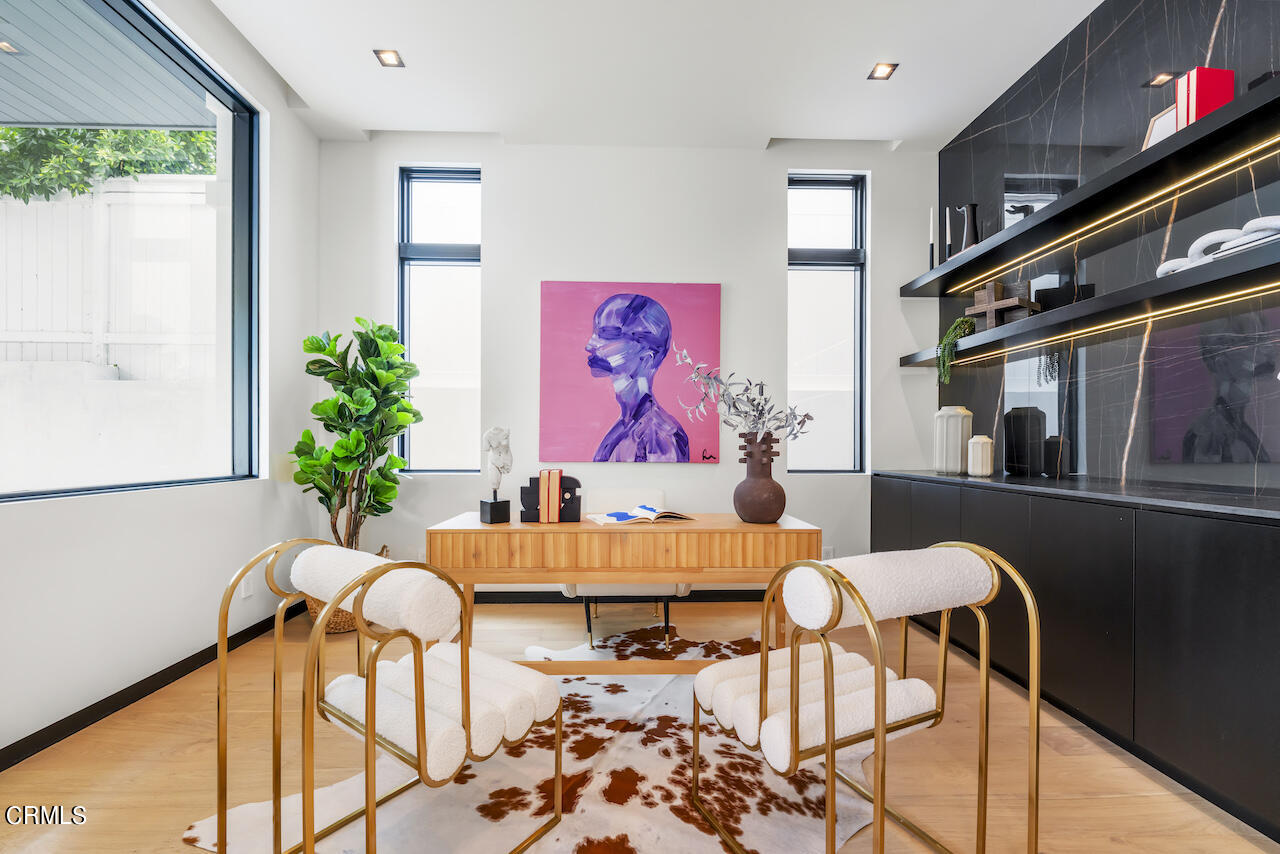 868 9th Street Manhattan Beach, CA 90266 - Photo 15 of 46 a living room with furniture and flowers