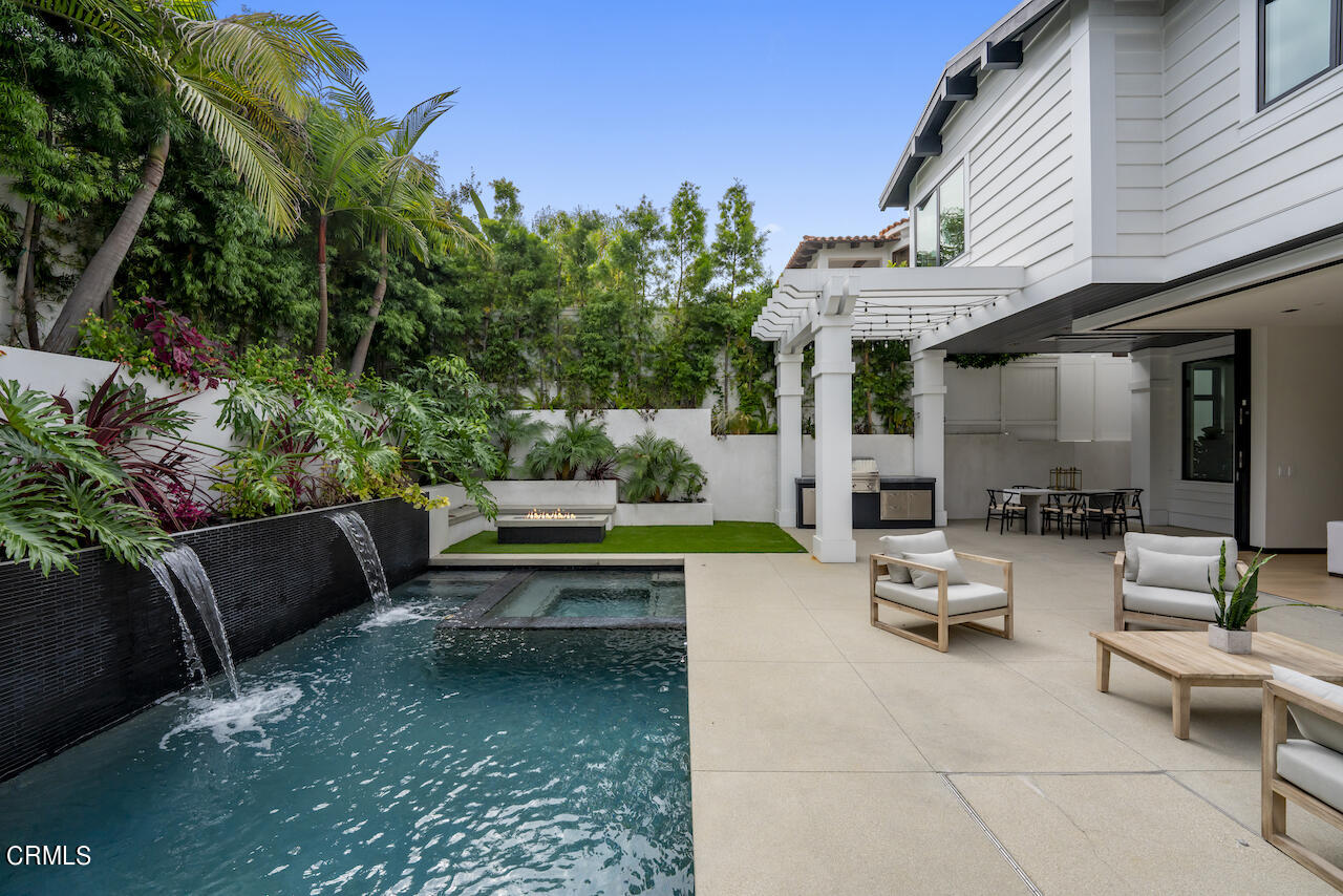 868 9th Street Manhattan Beach, CA 90266 - Photo 18 of 46 a view of backyard with outdoor seating and green space