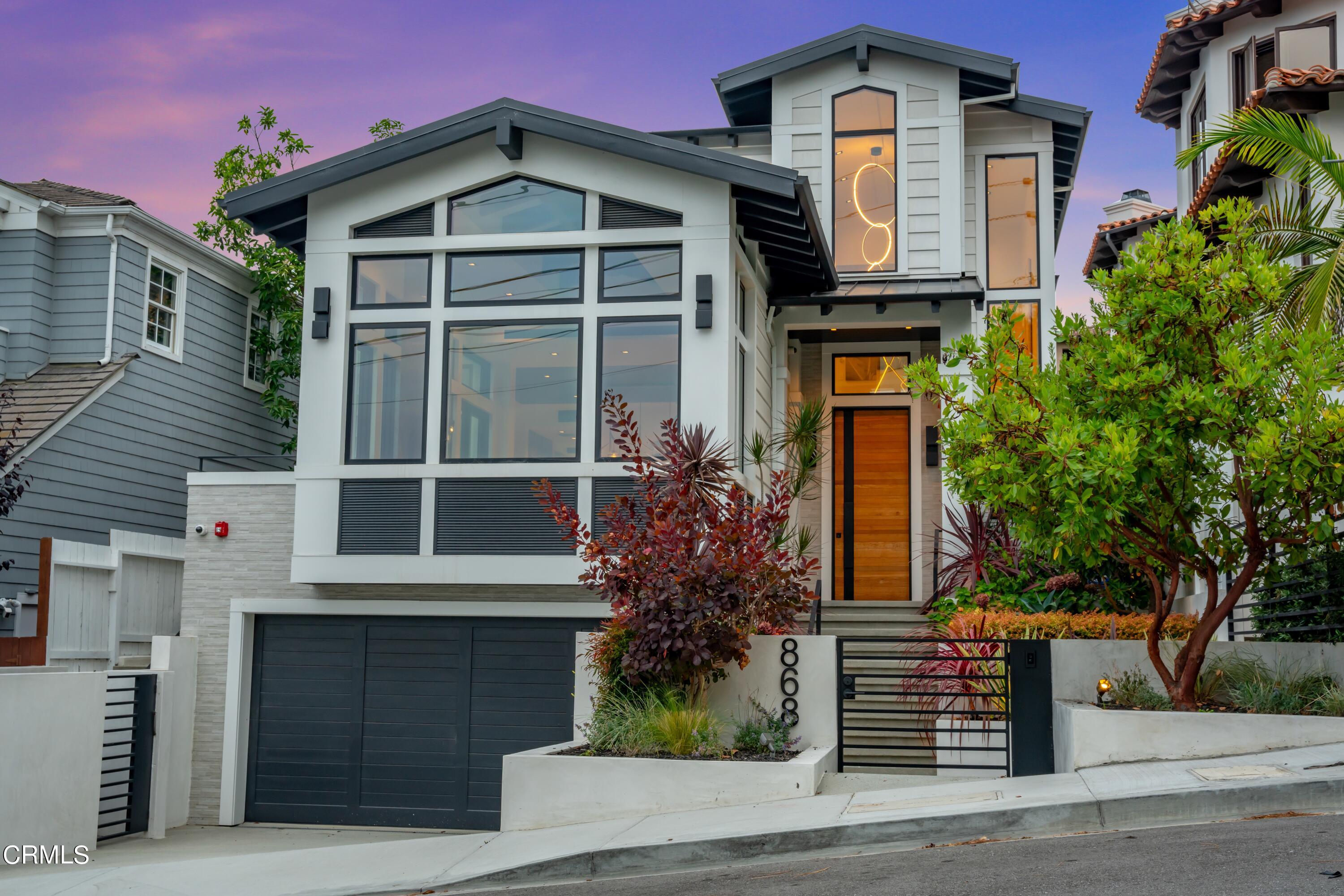 868 9th Street Manhattan Beach, CA 90266 - Photo 2 of 46 a front view of a house with garden