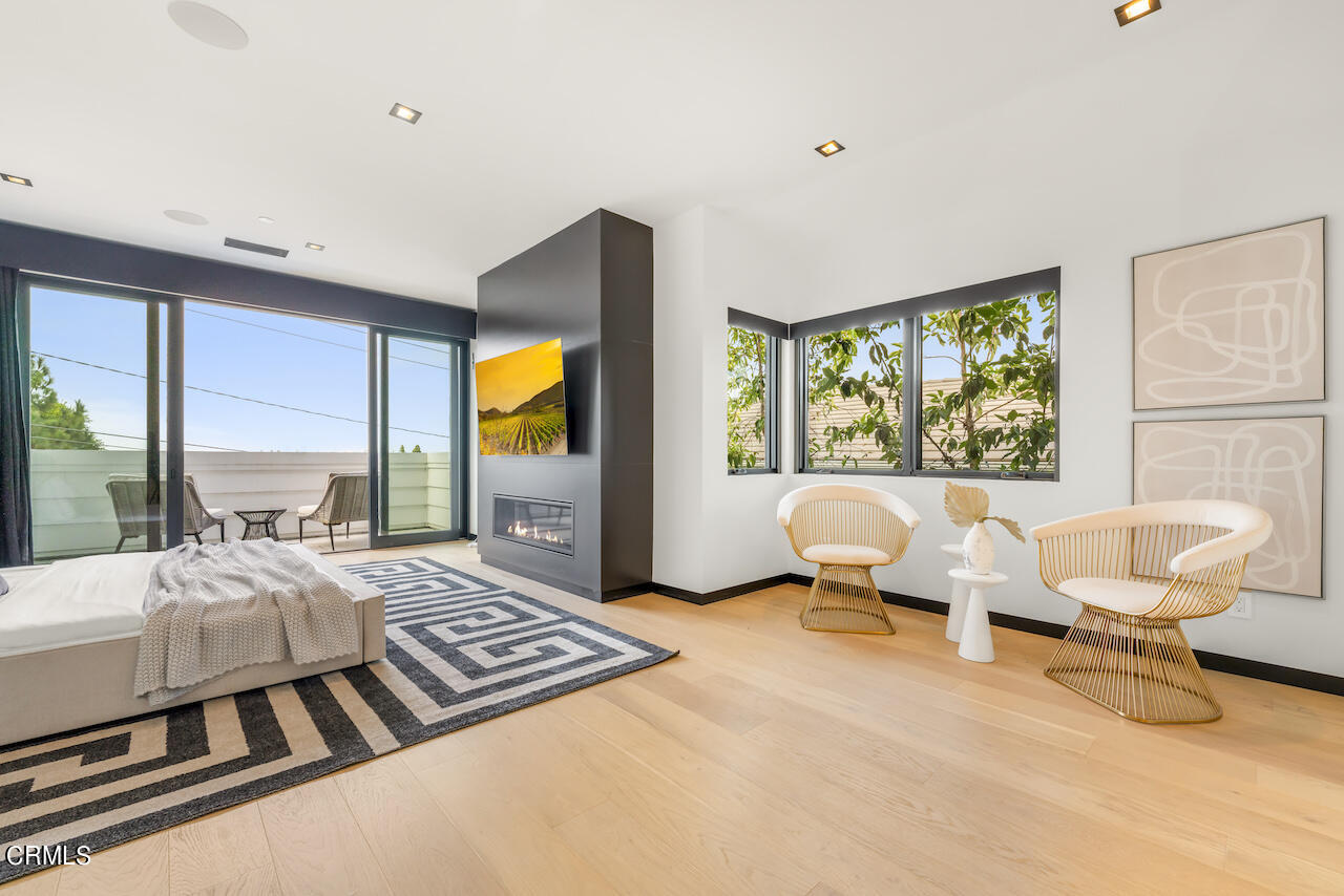 868 9th Street Manhattan Beach, CA 90266 - Photo 23 of 46 a bedroom with furniture and large windows