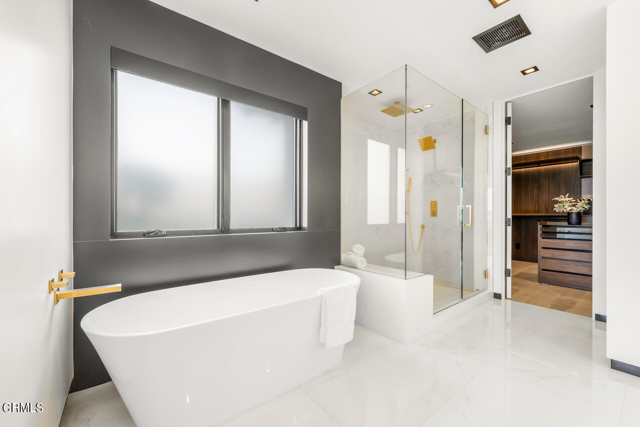 868 9th Street Manhattan Beach, CA 90266 - Photo 26 of 46 a bathroom with a bathtub and a shower