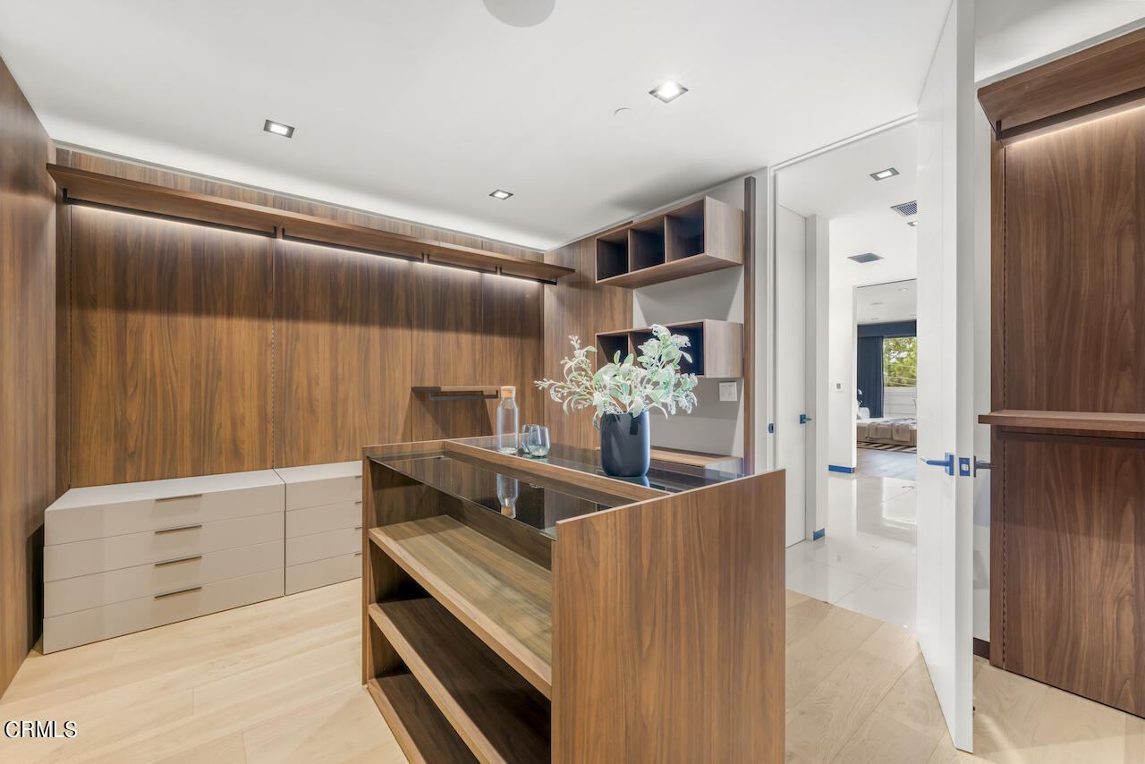 868 9th Street Manhattan Beach, CA 90266 - Photo 28 of 46 a kitchen with stainless steel appliances kitchen island granite countertop a refrigerator and a stove top oven