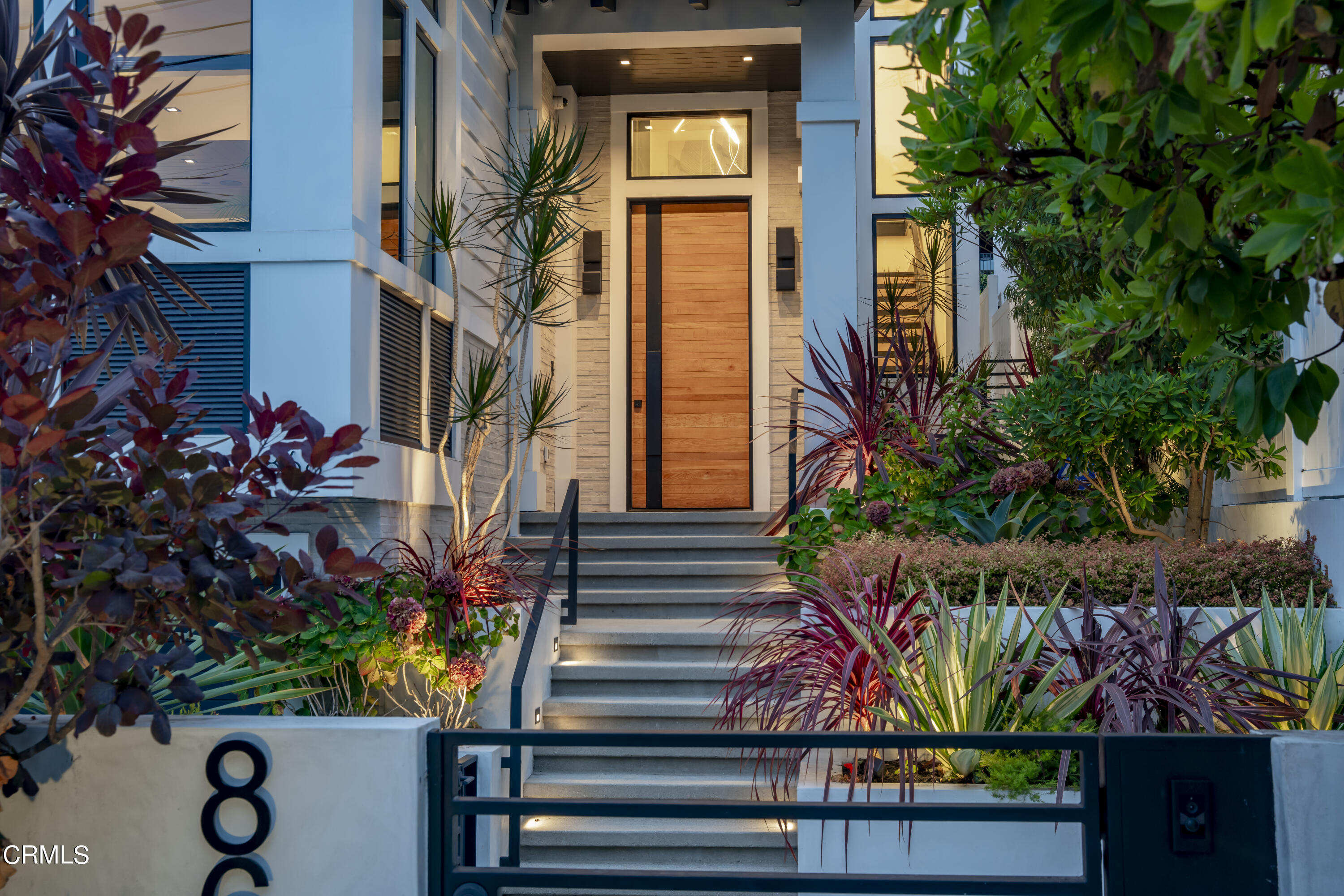 868 9th Street Manhattan Beach, CA 90266 - Photo 3 of 46 a view of a house with a flower garden