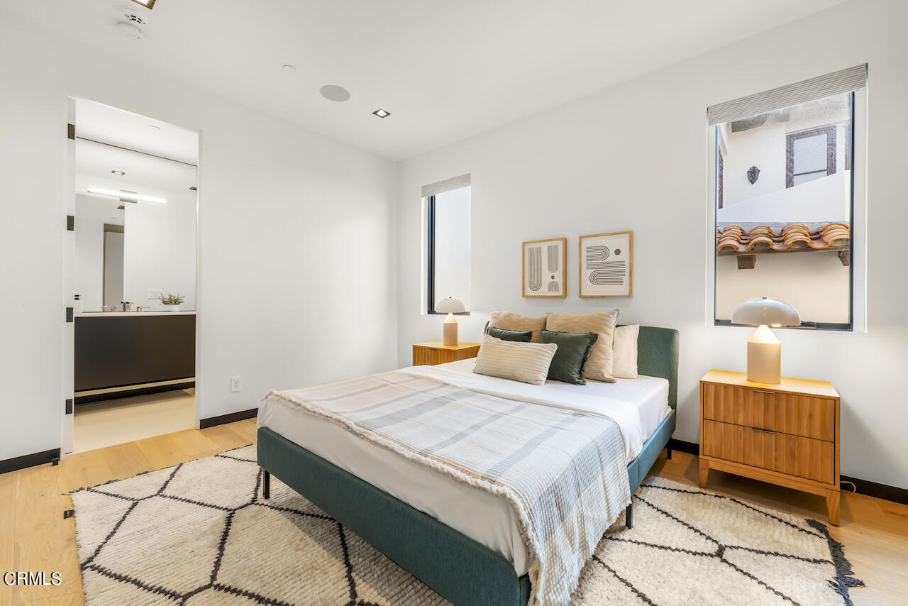 868 9th Street Manhattan Beach, CA 90266 - Photo 33 of 46 a bedroom with a bed and wooden floor