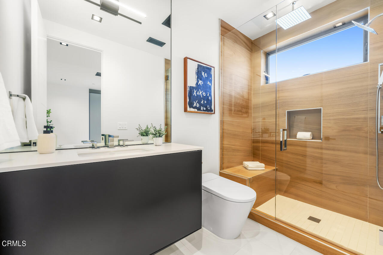 868 9th Street Manhattan Beach, CA 90266 - Photo 34 of 46 a bathroom with a sink a toilet and shower