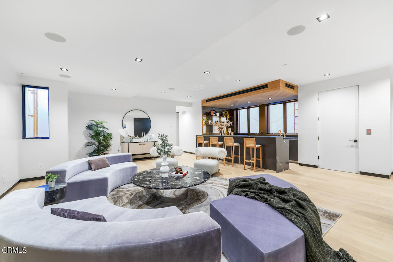 868 9th Street Manhattan Beach, CA 90266 - Photo 36 of 46 a living room with furniture fireplace and dining table