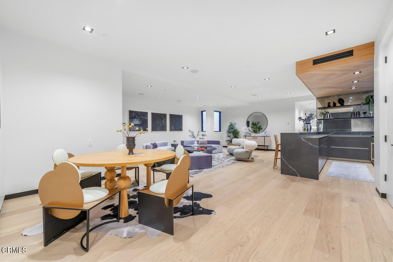 868 9th Street Manhattan Beach, CA 90266 - Photo 38 of 46 a living room with furniture a flat screen tv and kitchen view