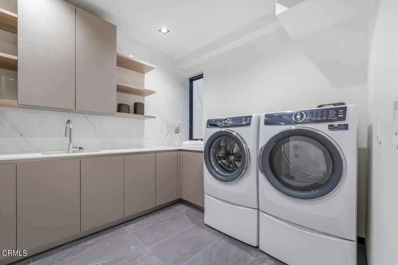 868 9th Street Manhattan Beach, CA 90266 - Photo 43 of 46 a utility room with sink dryer and washer