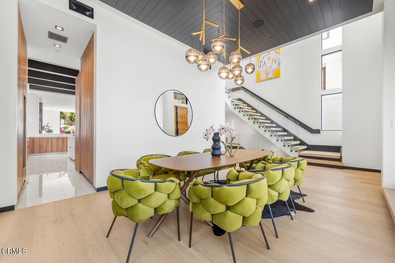 868 9th Street Manhattan Beach, CA 90266 - Photo 5 of 46 a view of a dining room with furniture and wooden floor