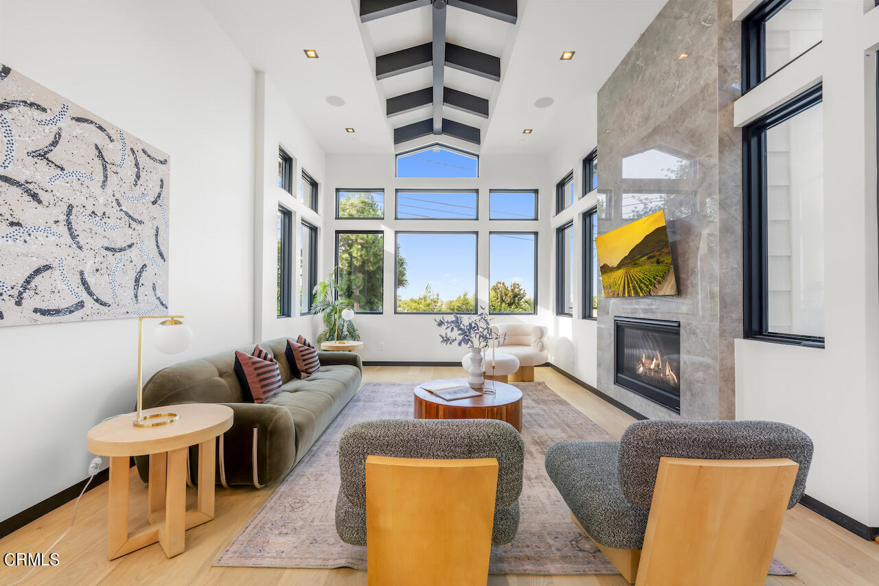 868 9th Street Manhattan Beach, CA 90266 - Photo 7 of 46 a living room with fireplace furniture and a window