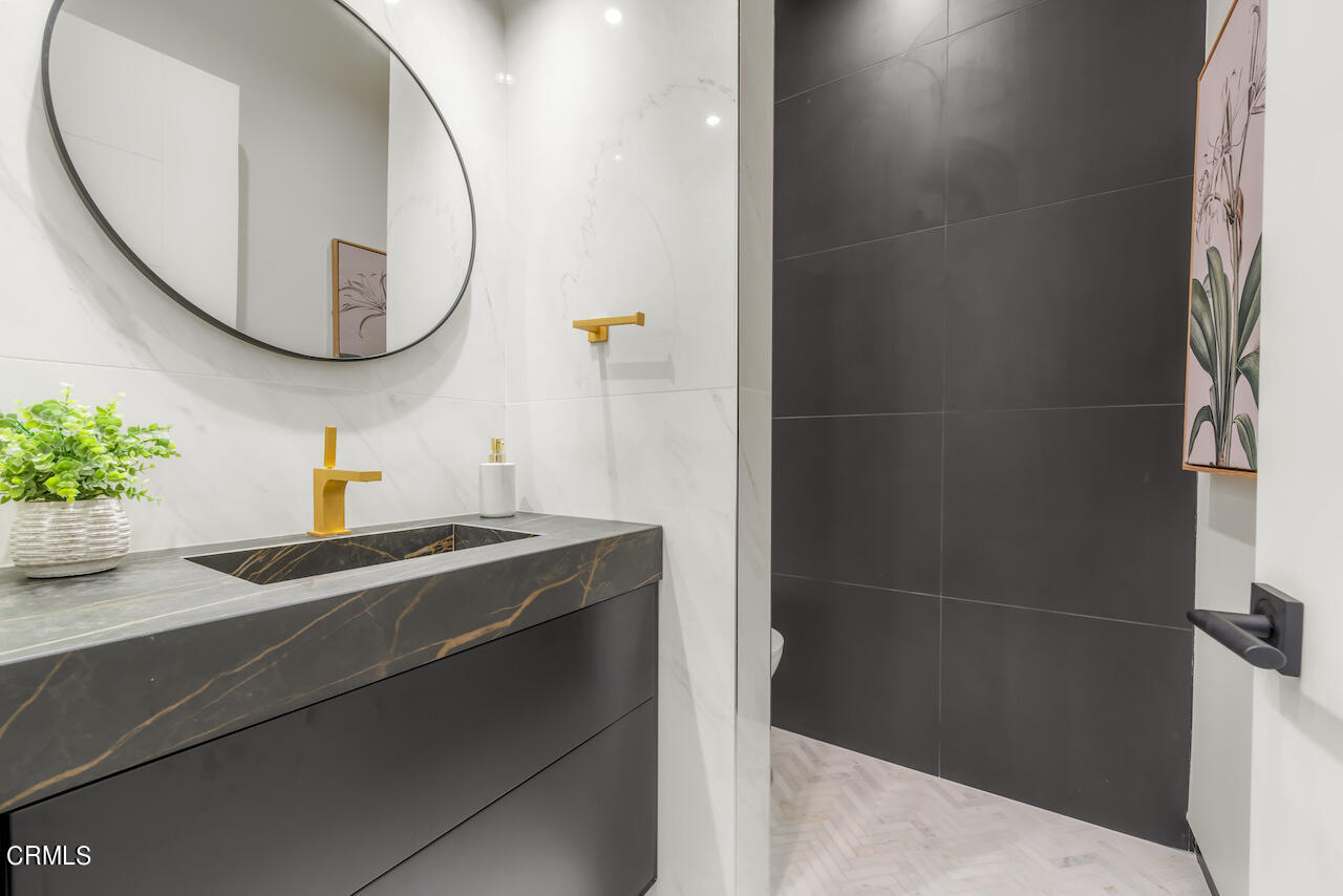 868 9th Street Manhattan Beach, CA 90266 - Photo 9 of 46 a bathroom with a sink and a mirror